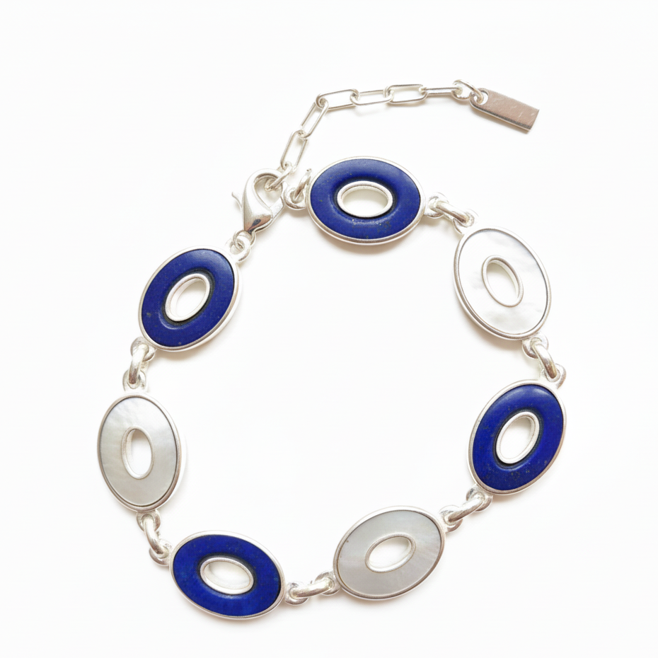 Bracelet with blue and silver circular links on a white background