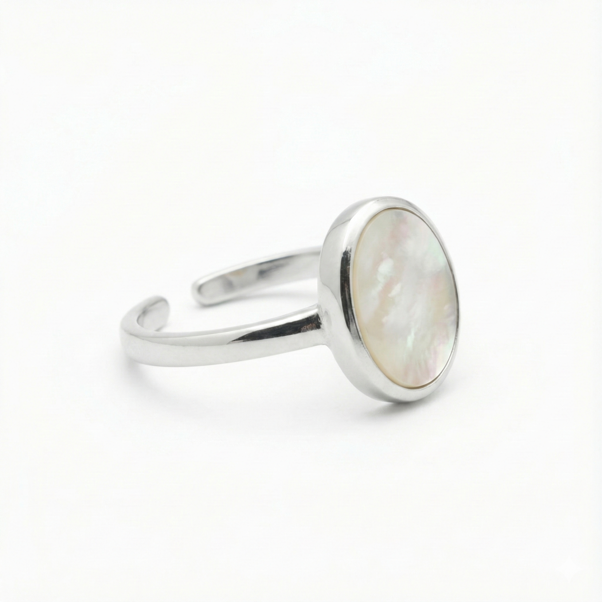 Mother of Pearl Oval Ring in sterling silver with smooth, iridescent white gemstone setting
