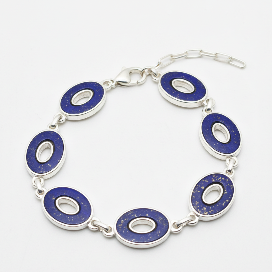 Bracelet with blue circular links on a white background