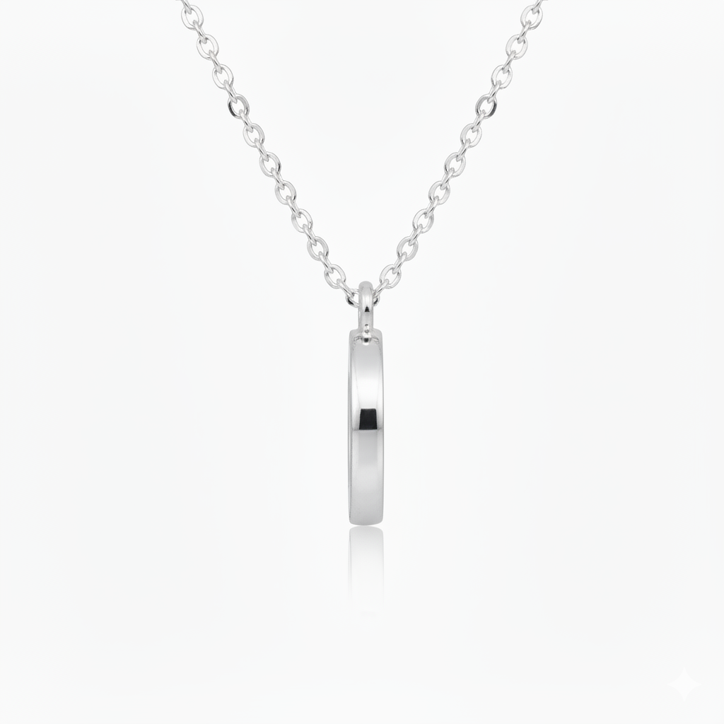 Silver necklace with a round pendant on a white background